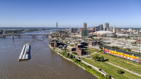 Riverfront buildings and river barge in Downtown St. Louis, Missouri Aerial Stock Photos | DXP001_023_0003