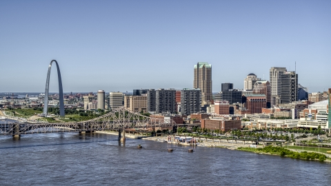 Riverfront office buildings near a bridge with Arch in the background, Downtown St. Louis, Missouri Aerial Stock Photos | DXP001_023_0009