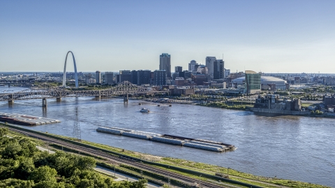 A view of a barge on the river, and bridge near Gateway Arch, Downtown St. Louis, Missouri Aerial Stock Photos | DXP001_026_0001