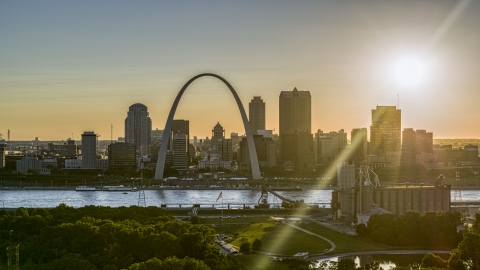 DXP001_028_0001 - Aerial stock photo of The setting sun behind the Downtown St. Louis, Missouri skyline