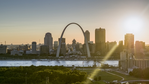 A view of the famous Gateway Arch and the Downtown St. Louis, Missouri skyline at sunset Aerial Stock Photos | DXP001_028_0004