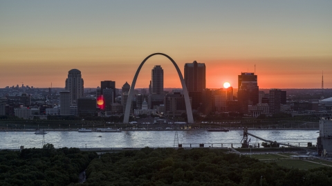 Famous Gateway Arch and the Downtown St. Louis, Missouri skyline in silhouette at sunset Aerial Stock Photos | DXP001_029_0011