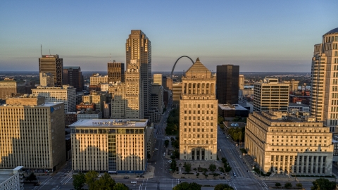 DXP001_035_0005 - Aerial stock photo of Gateway Arch behind courthouses at sunset, Downtown St. Louis, Missouri