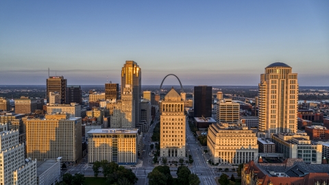 DXP001_035_0011 - Aerial stock photo of Gateway Arch visible behind the courthouses in downtown at sunset, Downtown St. Louis, Missouri