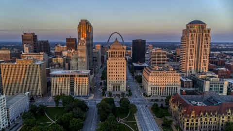 DXP001_036_0002 - Aerial stock photo of The Gateway Arch behind a courthouse at sunset, Downtown St. Louis, Missouri