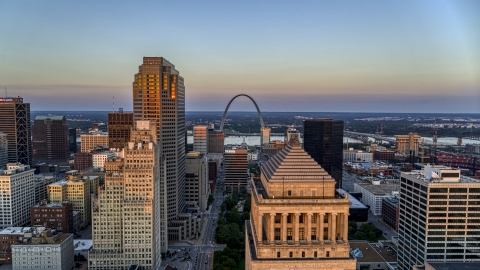 DXP001_036_0003 - Aerial stock photo of The Gateway Arch seen from the top of a downtown courthouse at sunset, Downtown St. Louis, Missouri