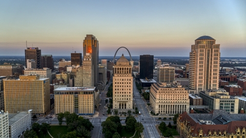 The Arch behind the courthouses and skyscrapers at twilight, Downtown St. Louis, Missouri Aerial Stock Photos | DXP001_036_0004