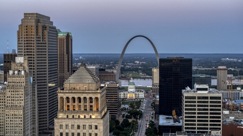 The Gateway Arch and museum at twilight, seen across Downtown St. Louis, Missouri Aerial Stock Photos | DXP001_036_0012