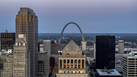 Gateway Arch at twilight, visible from a courthouse in Downtown St. Louis, Missouri Aerial Stock Photos | DXP001_036_0014