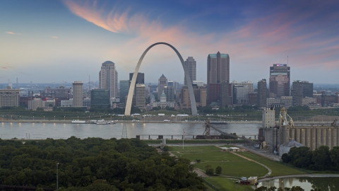 The Arch and skyline in Downtown St. Louis, Missouri, by Mississippi River at twilight Aerial Stock Photos | DXP001_037_0008