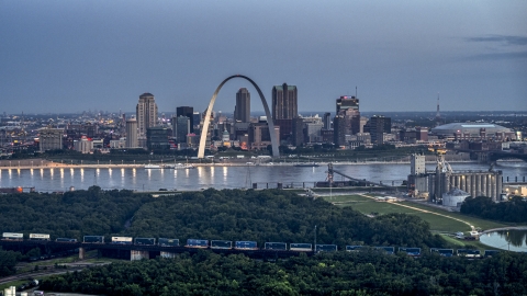 The famous Gateway Arch across the Mississippi River at twilight, Downtown St. Louis, Missouri Aerial Stock Photos | DXP001_037_0011