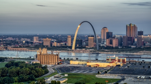 Sunlight on the St. Louis Arch by the Mississippi River at sunrise in Downtown St. Louis, Missouri Aerial Stock Photos | DXP001_038_0005