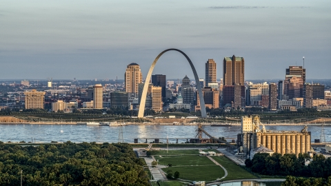 The St. Louis Arch beside the river at sunrise in Downtown St. Louis, Missouri Aerial Stock Photos | DXP001_038_0006