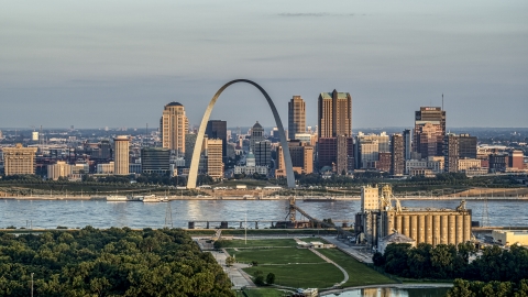 A view of the St. Louis Arch and the city skyline at sunrise in Downtown St. Louis, Missouri Aerial Stock Photos | DXP001_038_0007