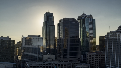 DXP001_050_0006 - Aerial stock photo of Towering city skyscrapers at sunset in Downtown Kansas City, Missouri