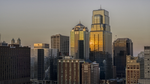 DXP001_051_0002 - Aerial stock photo of Light reflecting off of skyscrapers at sunset in Downtown Kansas City, Missouri