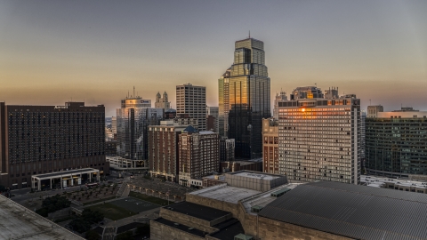 DXP001_051_0011 - Aerial stock photo of One Kansas City Place towering over other skyscrapers at sunset in Downtown Kansas City, Missouri