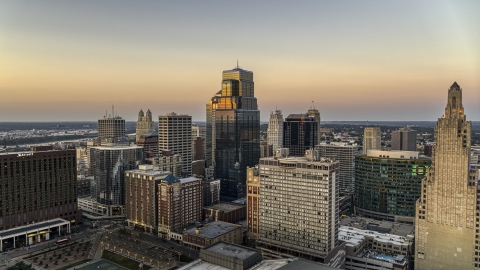 DXP001_051_0014 - Aerial stock photo of A group of skyscrapers and city buildings at twilight in Downtown Kansas City, Missouri