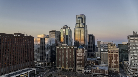 DXP001_051_0016 - Aerial stock photo of A downtown hotel and tall city skyscrapers at twilight in Downtown Kansas City, Missouri