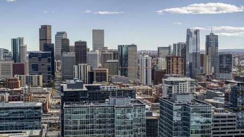 DXP001_055_0006 - Aerial stock photo of The city's skyline seen from office building rooftops in Downtown Denver, Colorado