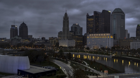 DXP001_087_0010 - Aerial stock photo of A view of city skyline at twilight from near the river in Downtown Columbus, Ohio