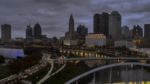 DXP001_087_0011 - Aerial stock photo of The city skyline at twilight seen from the river and bridges in Downtown Columbus, Ohio