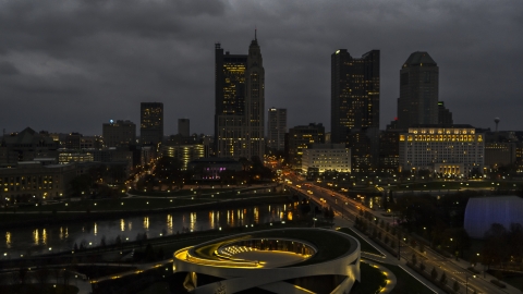 DXP001_088_0004 - Aerial stock photo of A view of the city skyline across the bridge and river at twilight, seen from the concert hall, Downtown Columbus, Ohio