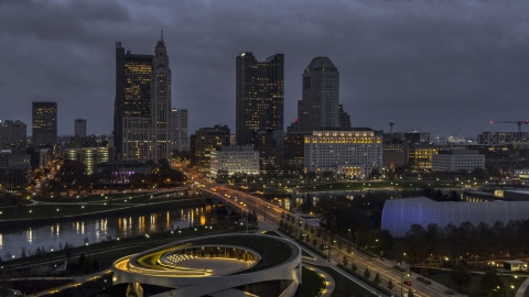 DXP001_088_0005 - Aerial stock photo of The city's downtown skyline across the bridge and river at twilight, Downtown Columbus, Ohio