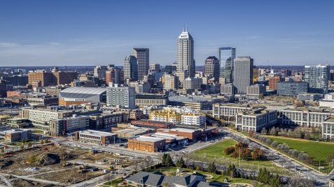 DXP001_090_0005 - Aerial stock photo of The city's skyline in Downtown Indianapolis, Indiana seen from smaller brick buildings