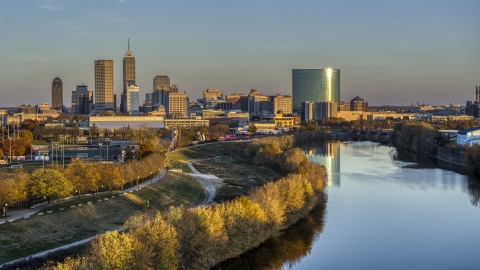 DXP001_092_0007 - Aerial stock photo of The city's skyline at sunset seen from White River, Downtown Indianapolis, Indiana