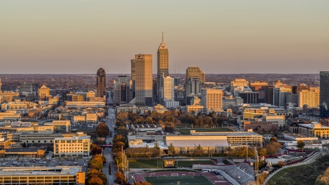 Wide view of the city's downtown skyline at sunset, Downtown Indianapolis, Indiana Aerial Stock Photos | DXP001_092_0012