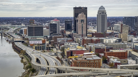 A view of skyscrapers from the riverfront freeway in Downtown Louisville, Kentucky Aerial Stock Photos | DXP001_095_0004