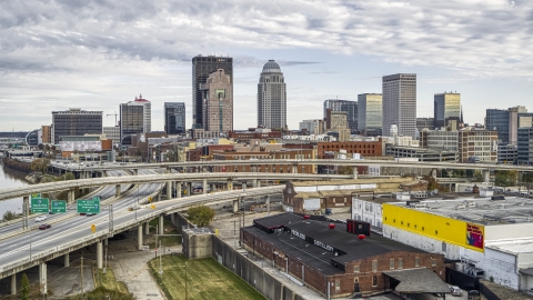 Skyscrapers seen behind freeway on an offramp in Downtown Louisville, Kentucky Aerial Stock Photos | DXP001_095_0006