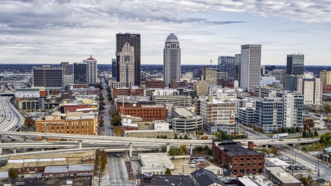 Tall skyscrapers in city skyline behind the freeway ramps in Downtown Louisville, Kentucky Aerial Stock Photos | DXP001_095_0007