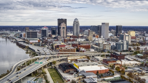 DXP001_095_0008 - Aerial stock photo of Riverfront freeway and city skyline in Downtown Louisville, Kentucky