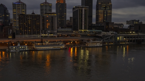 DXP001_096_0009 - Aerial stock photo of The city skyline at night across the river, Downtown Louisville, Kentucky