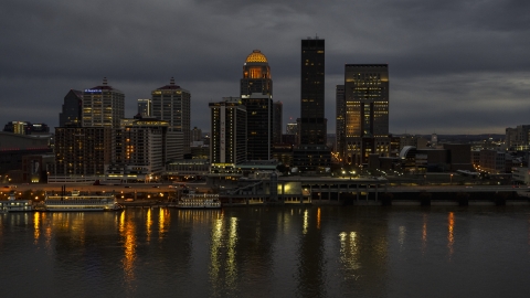 DXP001_096_0013 - Aerial stock photo of Tall skyscrapers lit up for the night in Downtown Louisville, Kentucky