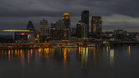 A view of the skyline lit up at twilight, seen from Ohio River, Downtown Louisville, Kentucky Aerial Stock Photos | DXP001_096_0014