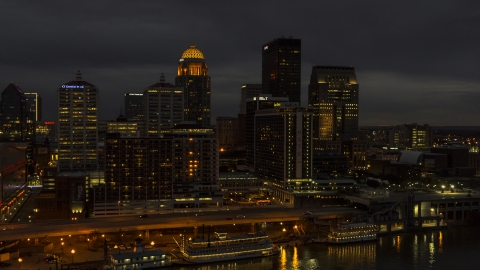 DXP001_096_0016 - Aerial stock photo of A view of hotel and the city skyline at twilight beside the river, Downtown Louisville, Kentucky