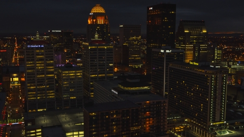 Tall buildings in the city's skyline lit up at twilight, Downtown Louisville, Kentucky Aerial Stock Photos | DXP001_096_0022