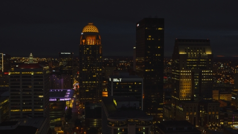 Towering skyscrapers lit up at twilight, Downtown Louisville, Kentucky Aerial Stock Photos | DXP001_096_0023