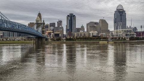 DXP001_097_0008 - Aerial stock photo of A view across the river by bridge focusing on city skyline, Downtown Cincinnati, Ohio