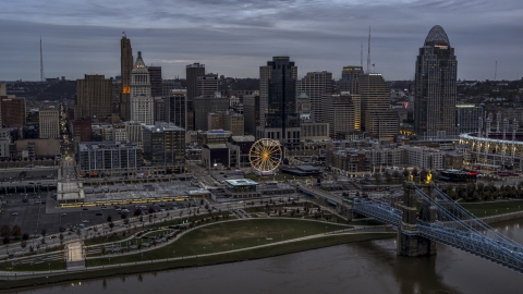 DXP001_097_0012 - Aerial stock photo of The city skyline's skyscrapers at sunset, seen from Ohio River, Downtown Cincinnati, Ohio