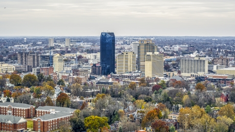 DXP001_099_0003 - Aerial stock photo of A view of the city's skyline, seen from tree-lined neighborhoods, Downtown Lexington, Kentucky