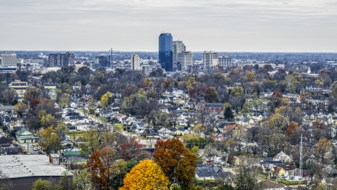 The city skyline while flying by tree-lined neighborhoods, Downtown Lexington, Kentucky Aerial Stock Photos | DXP001_099_0012