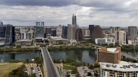 DXP002_102_0008 - Aerial stock photo of The First Street Bridge spanning Lady Bird Lake, looking toward the skyline, Downtown Austin, Texas