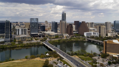 DXP002_102_0009 - Aerial stock photo of The city skyline seen from across Lady Bird Lake, Downtown Austin, Texas