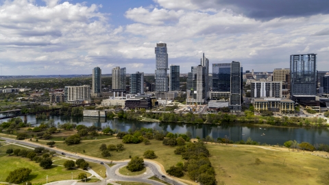 DXP002_102_0012 - Aerial stock photo of City skyscrapers across Lady Bird Lake, Downtown Austin, Texas