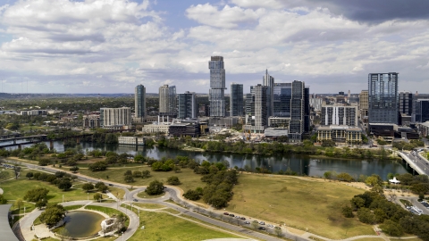 DXP002_102_0013 - Aerial stock photo of Skyscrapers across Lady Bird Lake, Downtown Austin, Texas