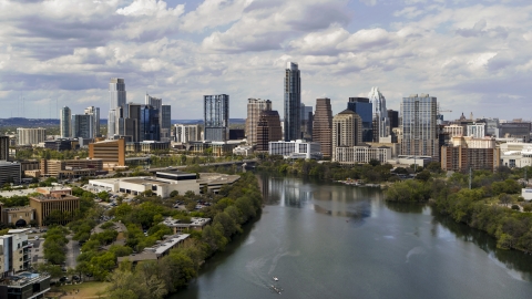 DXP002_102_0023 - Aerial stock photo of A view of the city skyline while flying over Lady Bird Lake, Downtown Austin, Texas